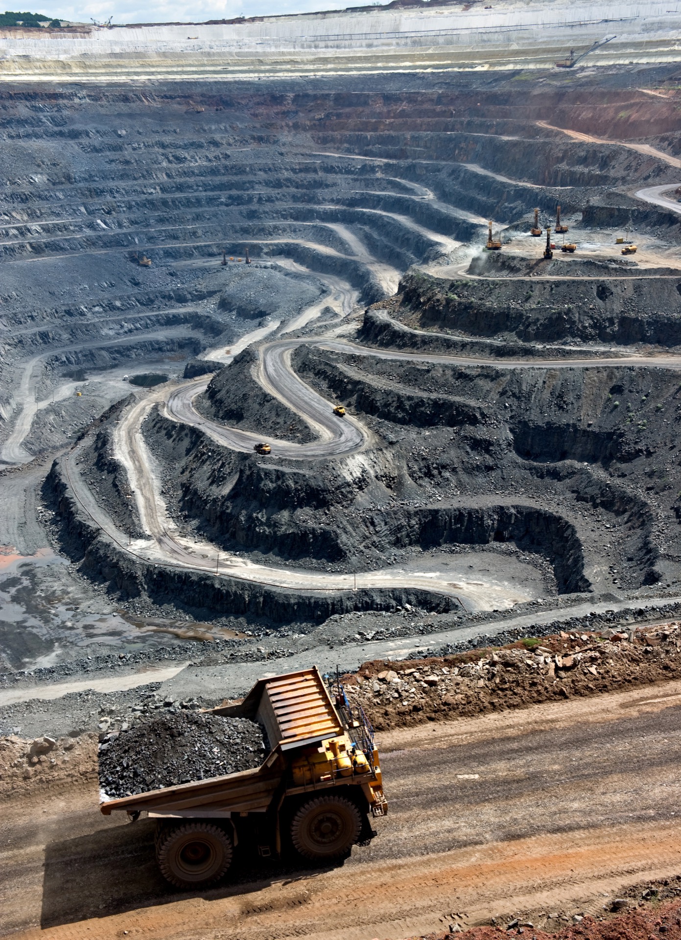 Mining vehicle at an industrial processing site